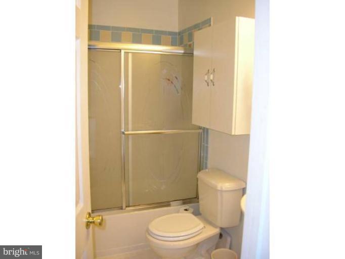 2390 Hunters Square Court Reston, VA 20191 - Photo 7 of 15 a bathroom with a toilet and a shower