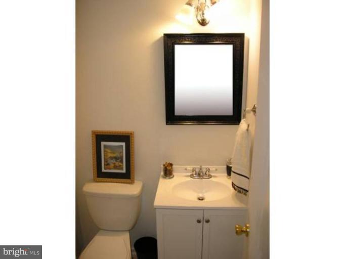 2390 Hunters Square Court Reston, VA 20191 - Photo 8 of 15 a bathroom with a toilet sink and mirror