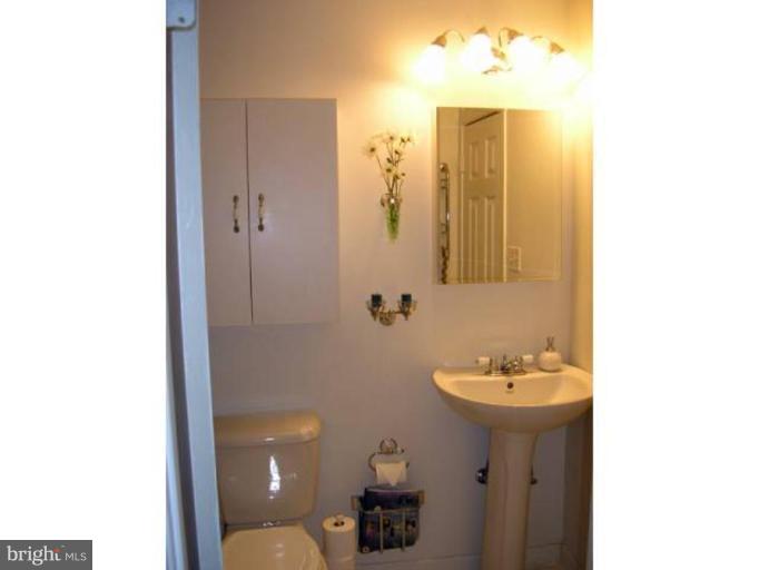 2390 Hunters Square Court Reston, VA 20191 - Photo 10 of 15 a bathroom with a sink a toilet and shower