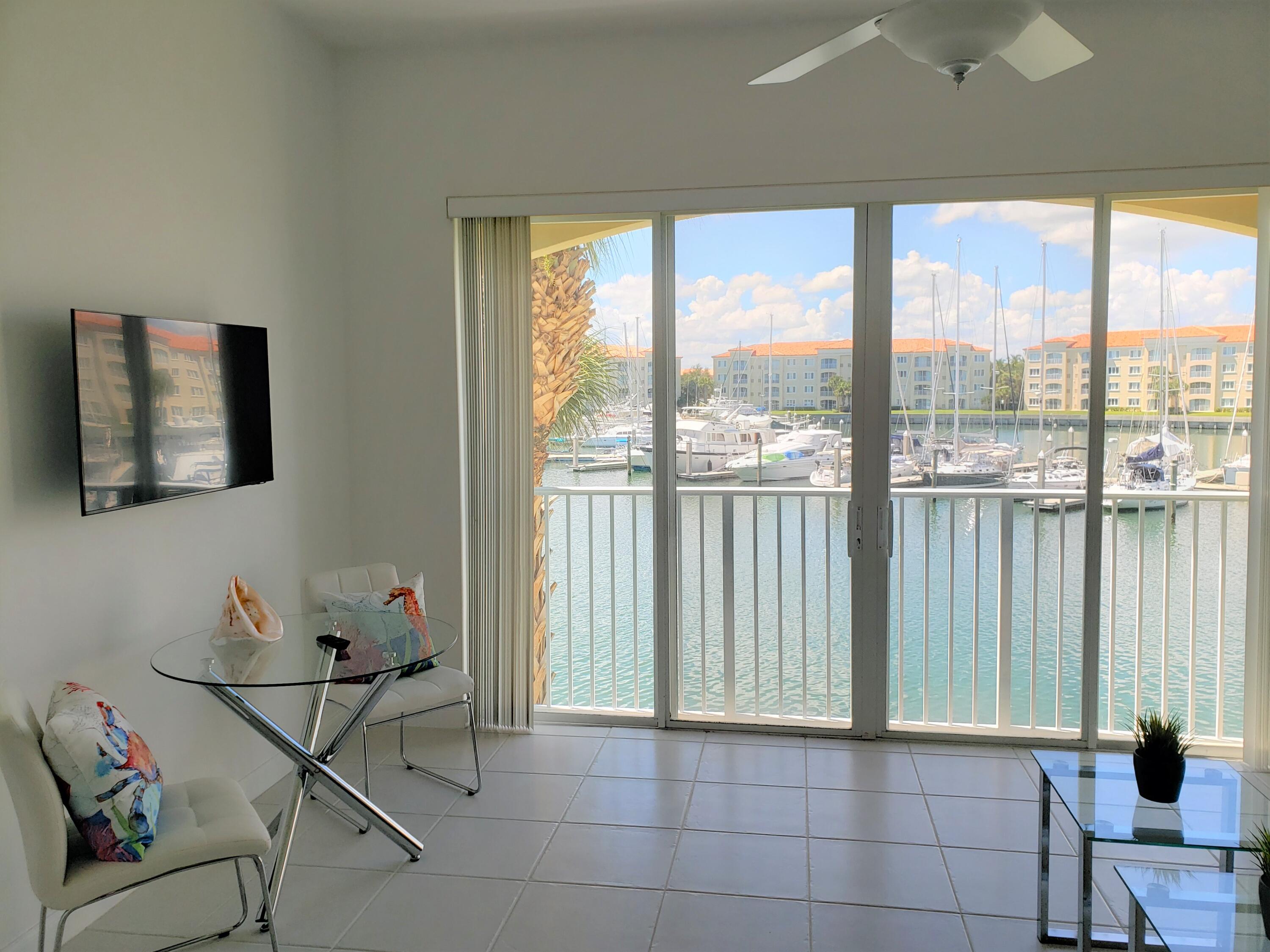 10 Harbour Isle Drive East, Unit 204 Fort Pierce, FL 34949 - Photo 11 of 20 a view of a room with furniture and floor to ceiling windows