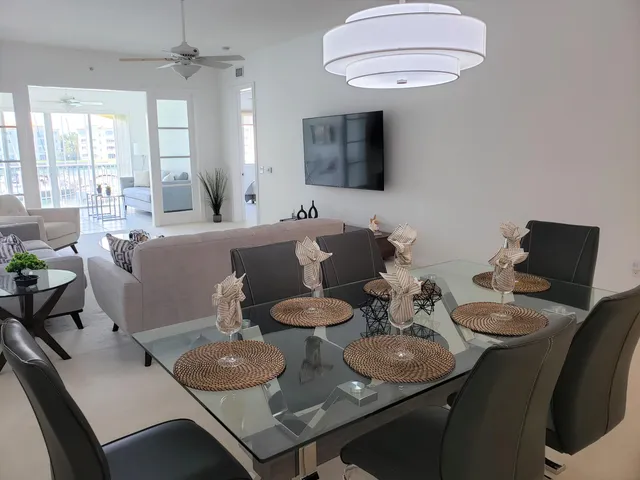a view of a dining room with furniture and wooden floor