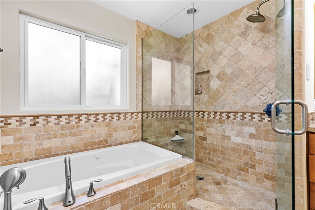 545 Spencer Street Glendale, CA 91202 - Photo 14 of 21 a bathroom with a bathtub and shower