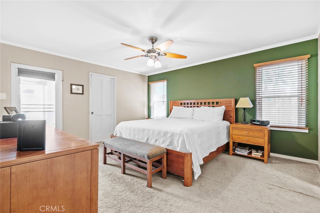 545 Spencer Street Glendale, CA 91202 - Photo 15 of 21 a spacious bedroom with a bed and a table in it