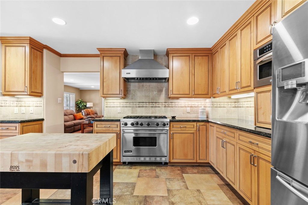 545 Spencer Street Glendale, CA 91202 - Photo 9 of 21 a kitchen with stainless steel appliances granite countertop a stove a sink dishwasher and a refrigerator