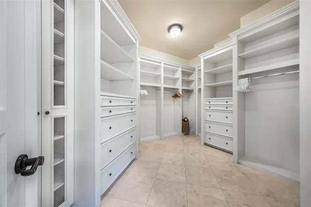 a bathroom with a tub a sink and mirror