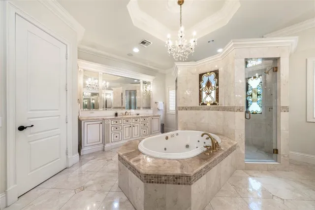 a bedroom with a bed and large window