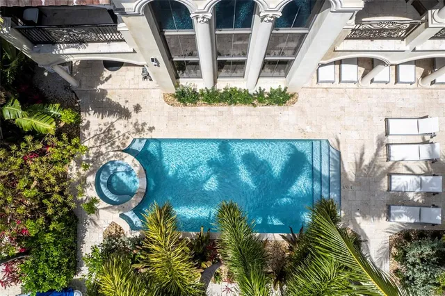 a view of a fountain in the backyard of a house