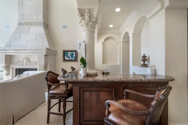 a dining room with furniture and a mirror