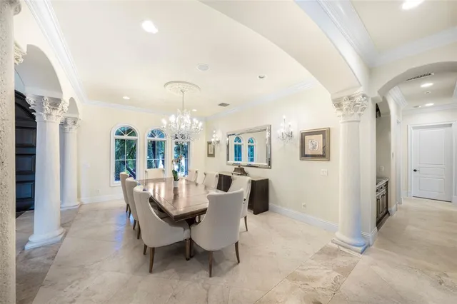 a dining room with furniture and wooden floor
