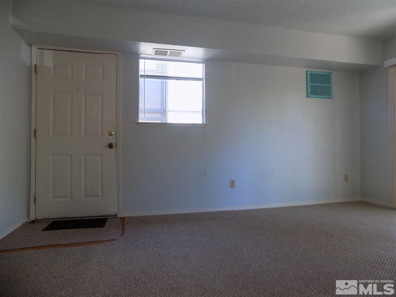 2189 Kietzke Lane Reno, NV 89502 - Photo 5 of 20 an empty room with a door