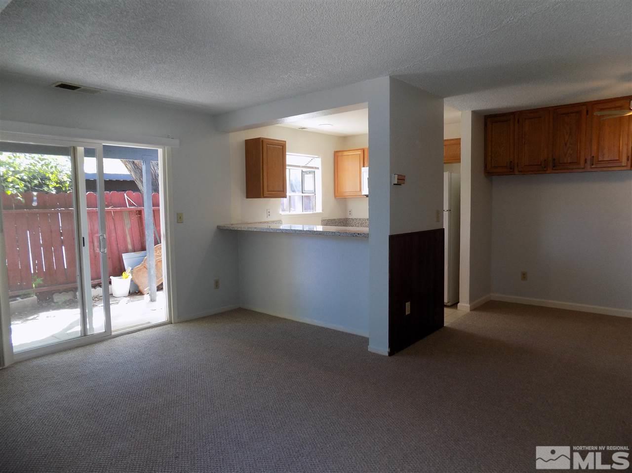 2189 Kietzke Lane Reno, NV 89502 - Photo 6 of 20 a view of an empty room with a fireplace