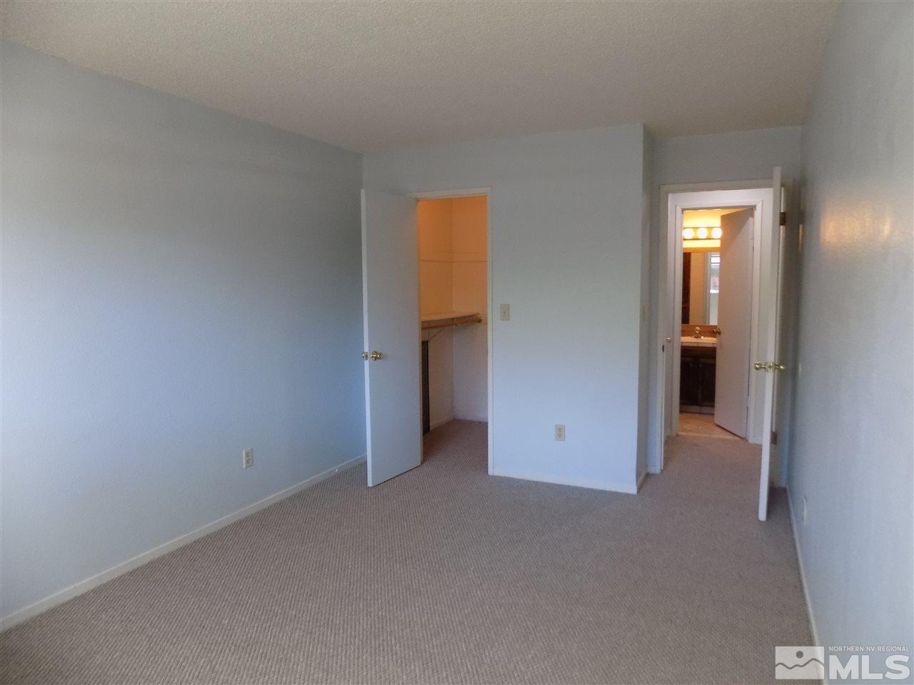 2189 Kietzke Lane Reno, NV 89502 - Photo 10 of 20 a view of an empty room with closet and wooden floor