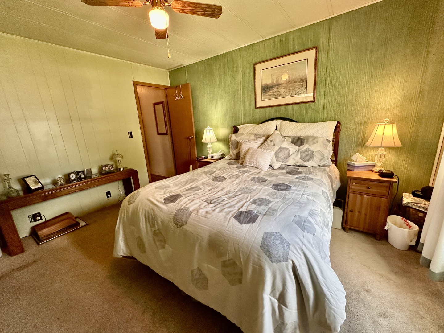1336 Douglas Avenue, Unit 13 Montgomery, IL 60538 - Photo 12 of 23 a spacious bedroom with a bed and a chandelier