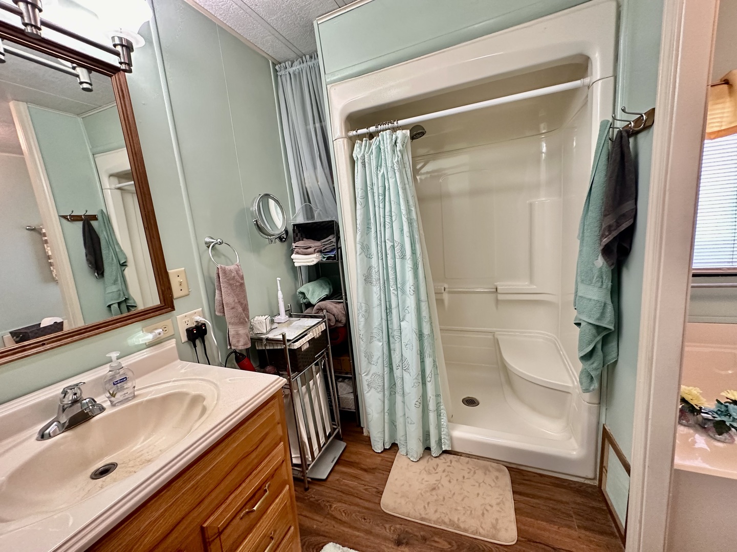 1336 Douglas Avenue, Unit 13 Montgomery, IL 60538 - Photo 14 of 23 a bathroom with a tub a sink and a mirror