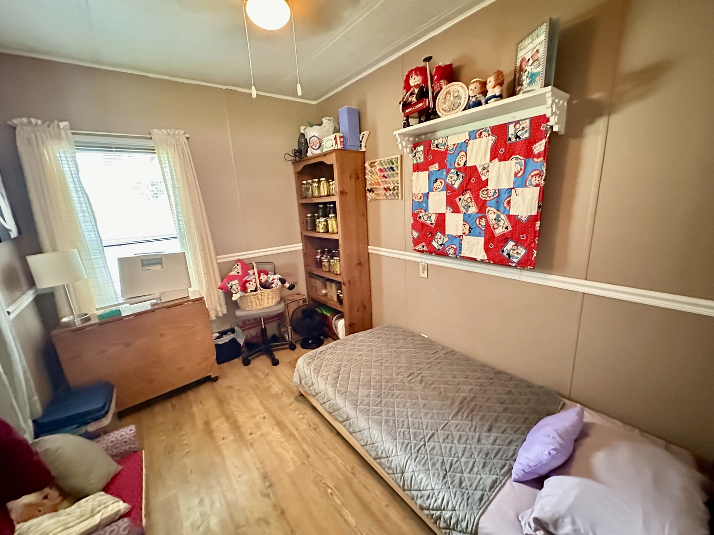 1336 Douglas Avenue, Unit 13 Montgomery, IL 60538 - Photo 15 of 23 a bedroom with furniture and a book shelf