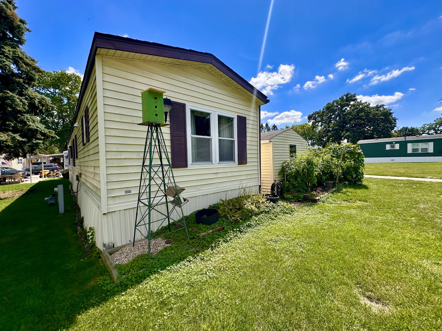 1336 Douglas Avenue, Unit 13 Montgomery, IL 60538 - Photo 19 of 23 a view of a house with backyard and sitting area