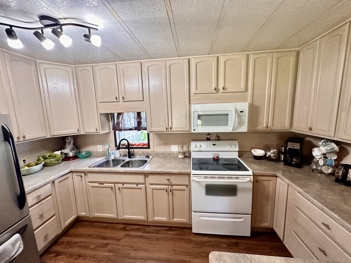1336 Douglas Avenue, Unit 13 Montgomery, IL 60538 - Photo 7 of 23 a kitchen with a white cabinets and white appliances