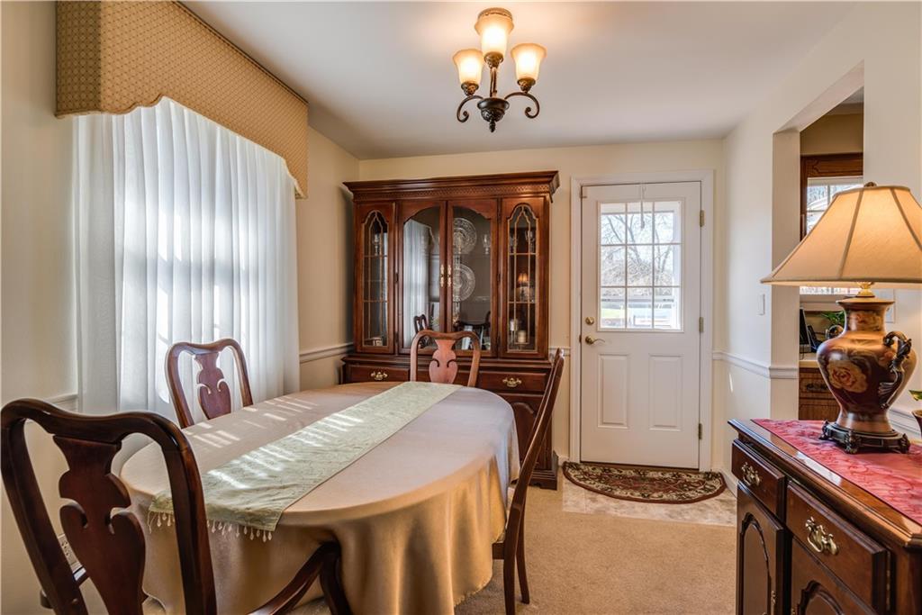 842 Rosalind Road Pittsburgh, PA 15237 - Photo 5 of 21 THE DINING ROOM MEASURES 11'5" X 9', ALSO HAS HARDWOOD UNDER THE CARPET AND THE NEW DOOR WALKS OUT TO THE DECK THAT WAS ADDED IN 2015.