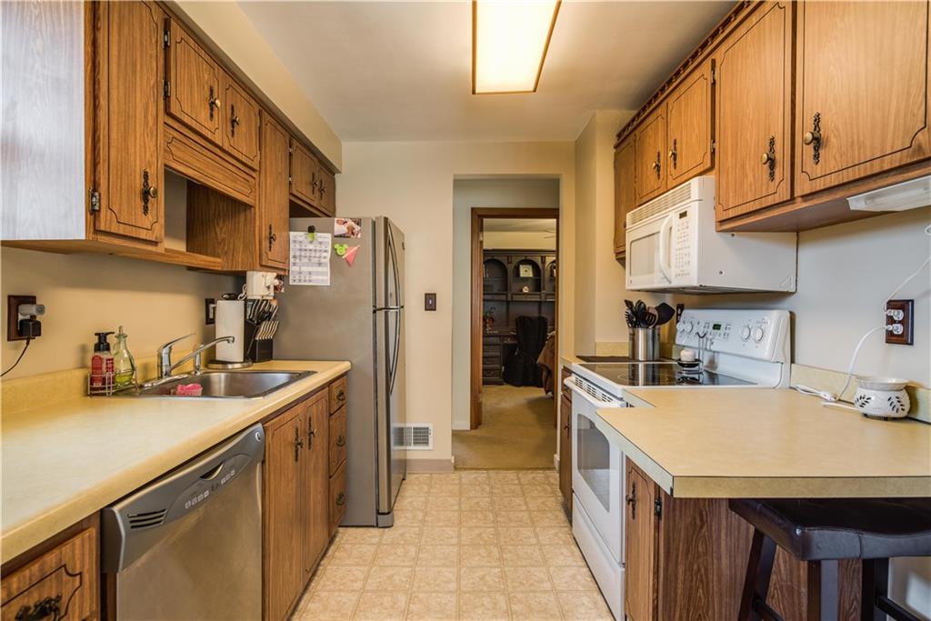 842 Rosalind Road Pittsburgh, PA 15237 - Photo 7 of 21 THE SUNNY KITCHEN FEATURES A NEW STAINLESS STEEL REFRIGERATOR AND DISHWASHER. THE ELECTRIC RANGE AND MICROWAVE ARE ABOUT 10 YEARS OLD, THERE'S A SIZABLE PANTRY TO THE RIGHT (NOT PICTURED).