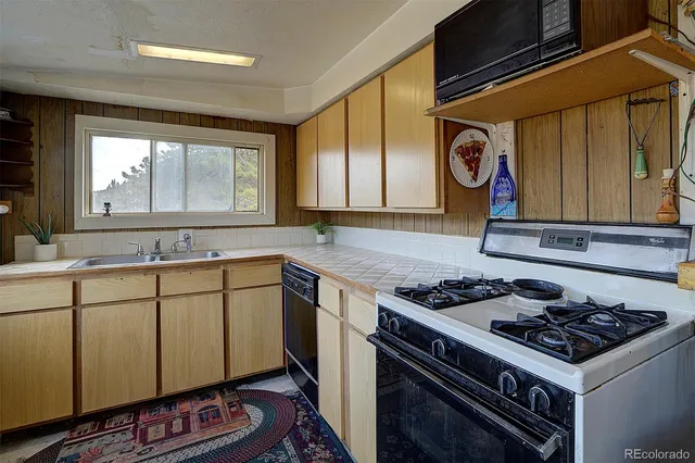 a kitchen with a stove and a sink