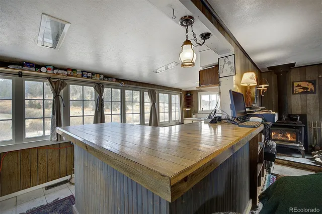 an open kitchen with a table and chairs in it