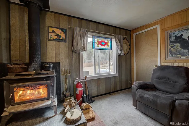 a living room with furniture a flat screen tv and a window
