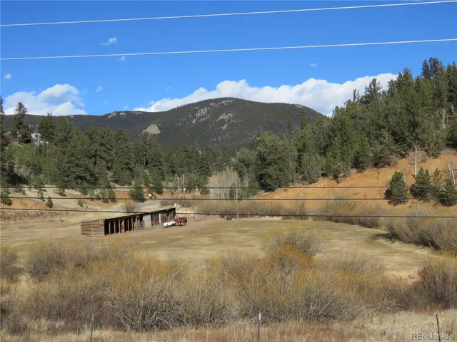 a view of a town with mountains in the background