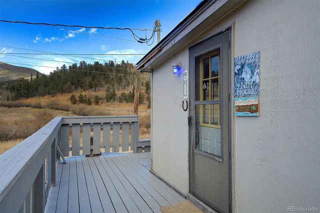 a view of balcony with furniture