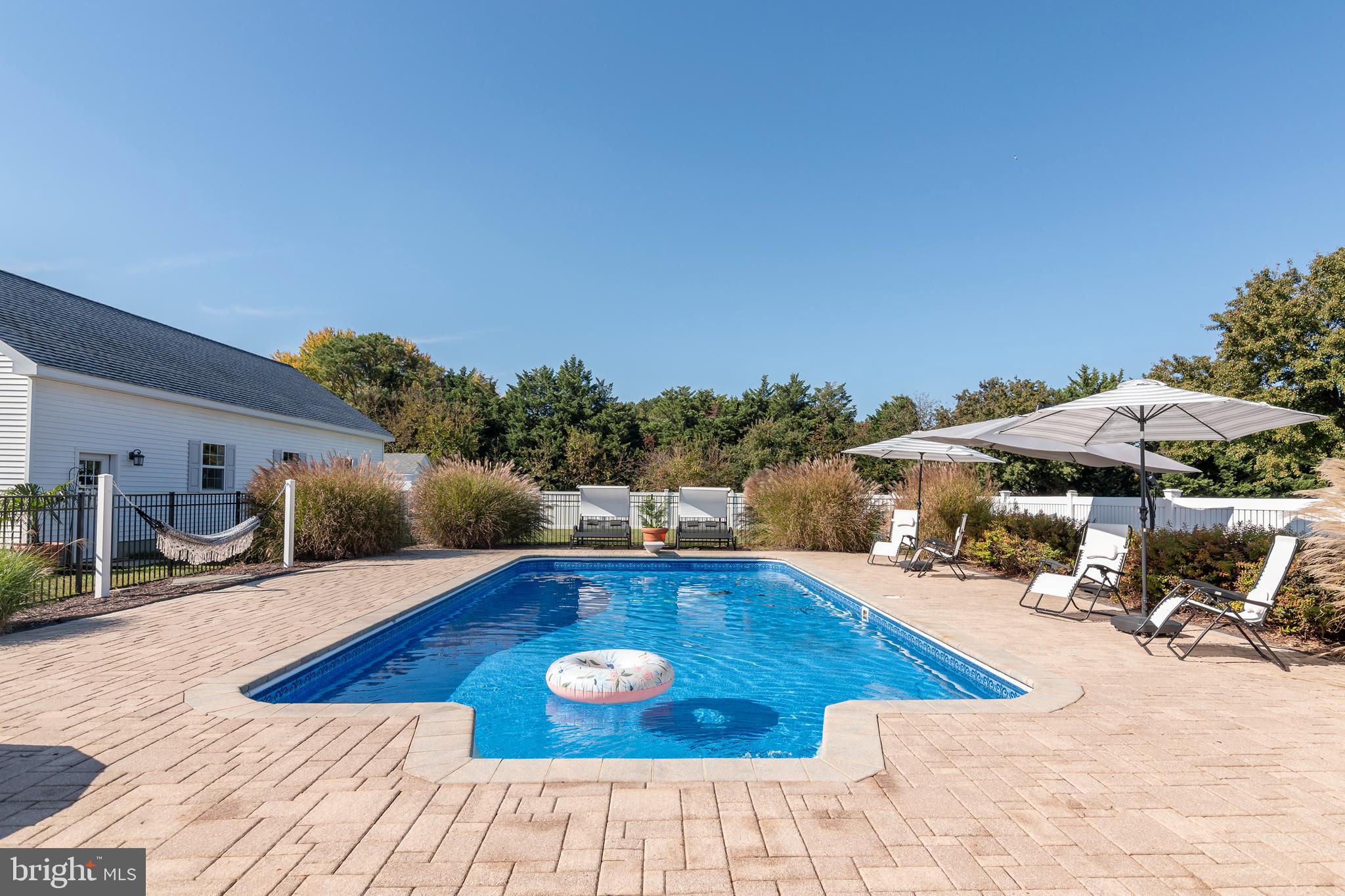 6660 Reeses Pride Road Sherwood, MD 21665 - Photo 17 of 72 a view of a swimming pool with lounge chair