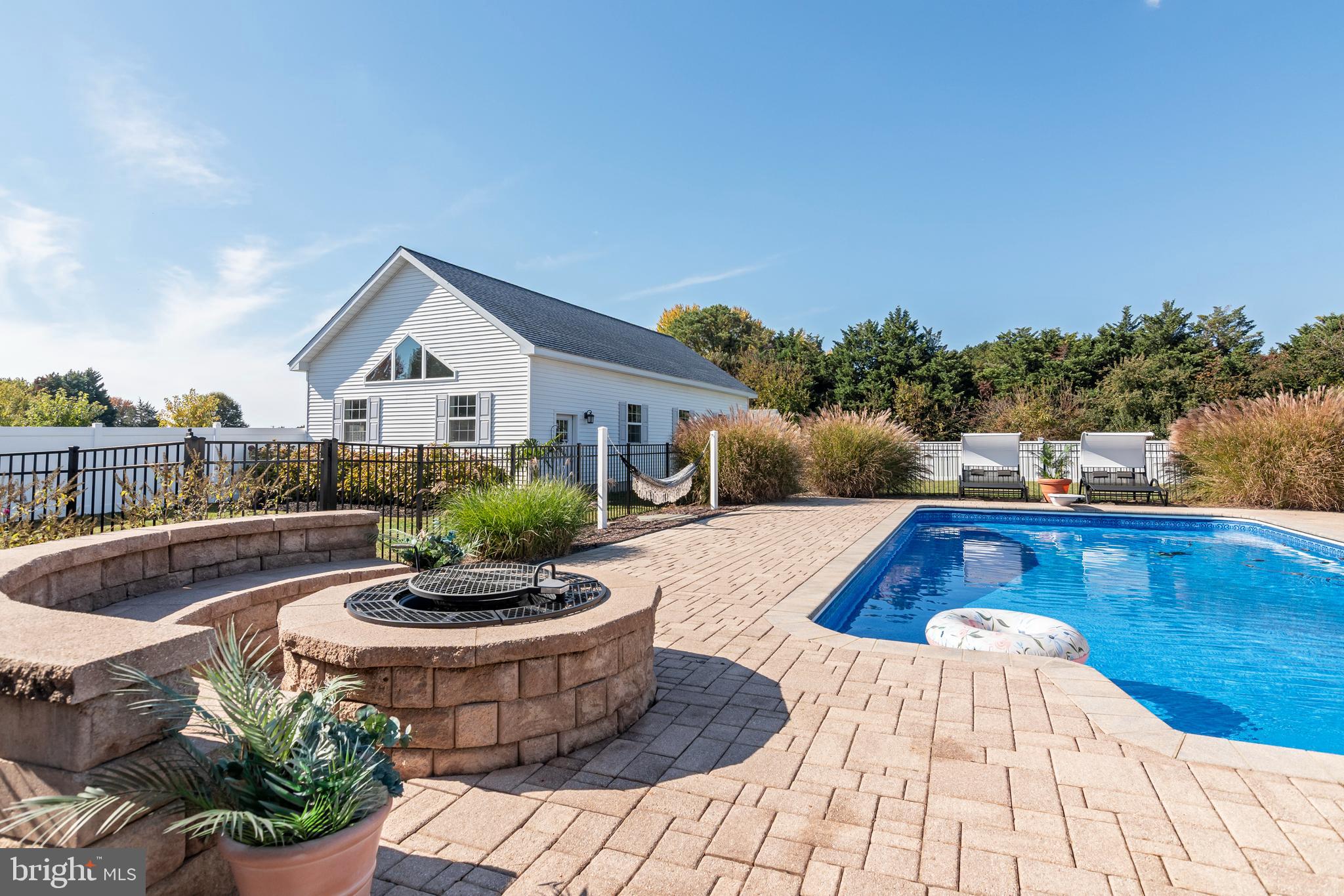 6660 Reeses Pride Road Sherwood, MD 21665 - Photo 21 of 72 a view of a swimming pool with a patio