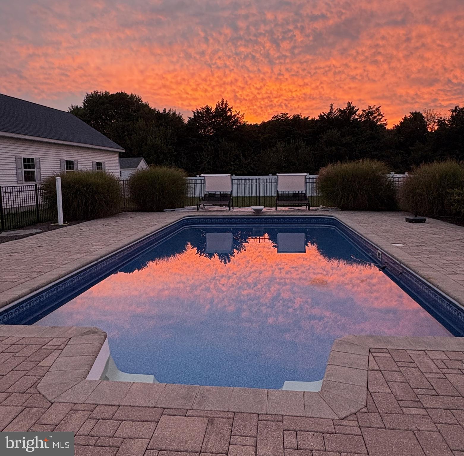 6660 Reeses Pride Road Sherwood, MD 21665 - Photo 24 of 72 a view of a swimming pool and a lounge chair