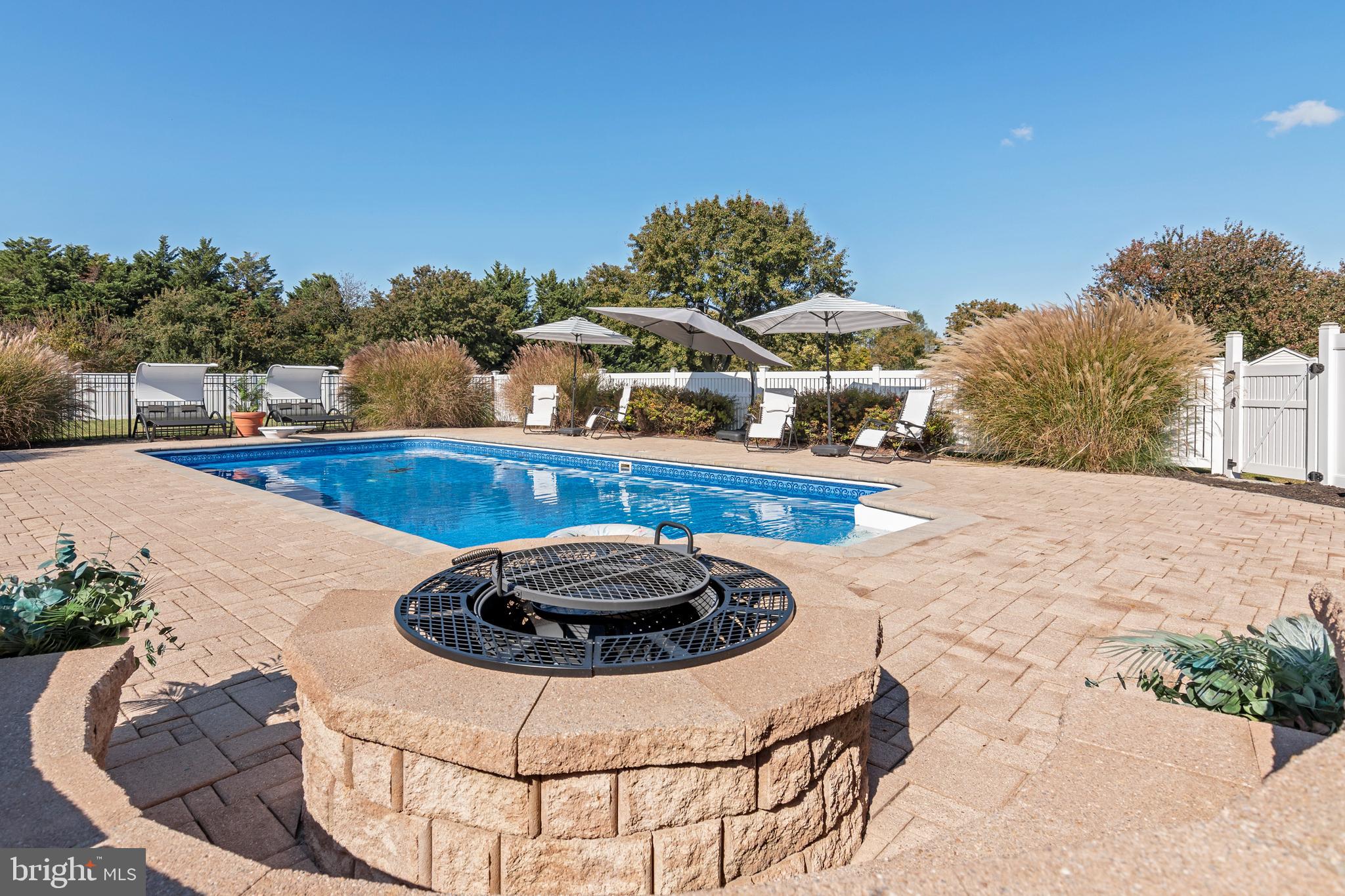 6660 Reeses Pride Road Sherwood, MD 21665 - Photo 26 of 72 a view of a swimming pool with a patio