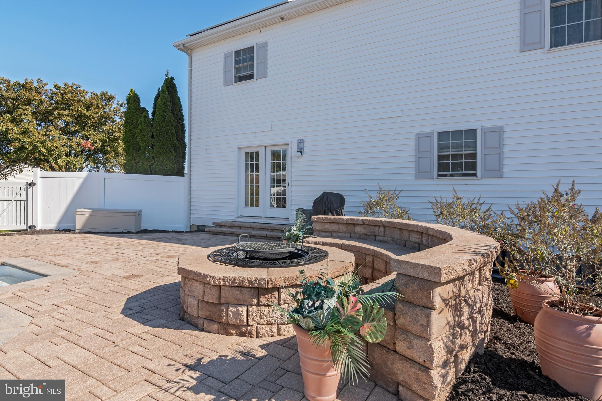 6660 Reeses Pride Road Sherwood, MD 21665 - Photo 27 of 72 a table and chairs in front of a house