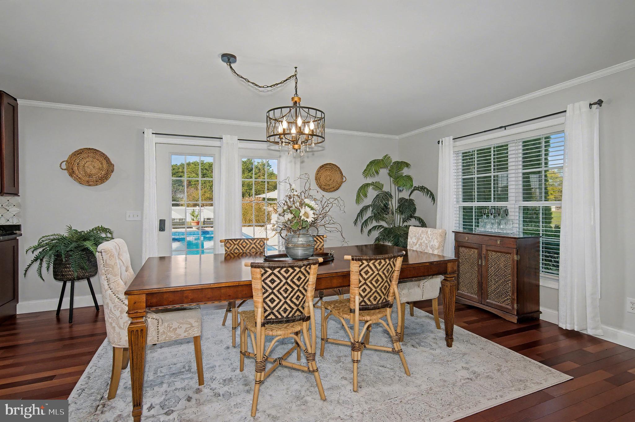 6660 Reeses Pride Road Sherwood, MD 21665 - Photo 35 of 72 a view of a dining room with furniture window and wooden floor
