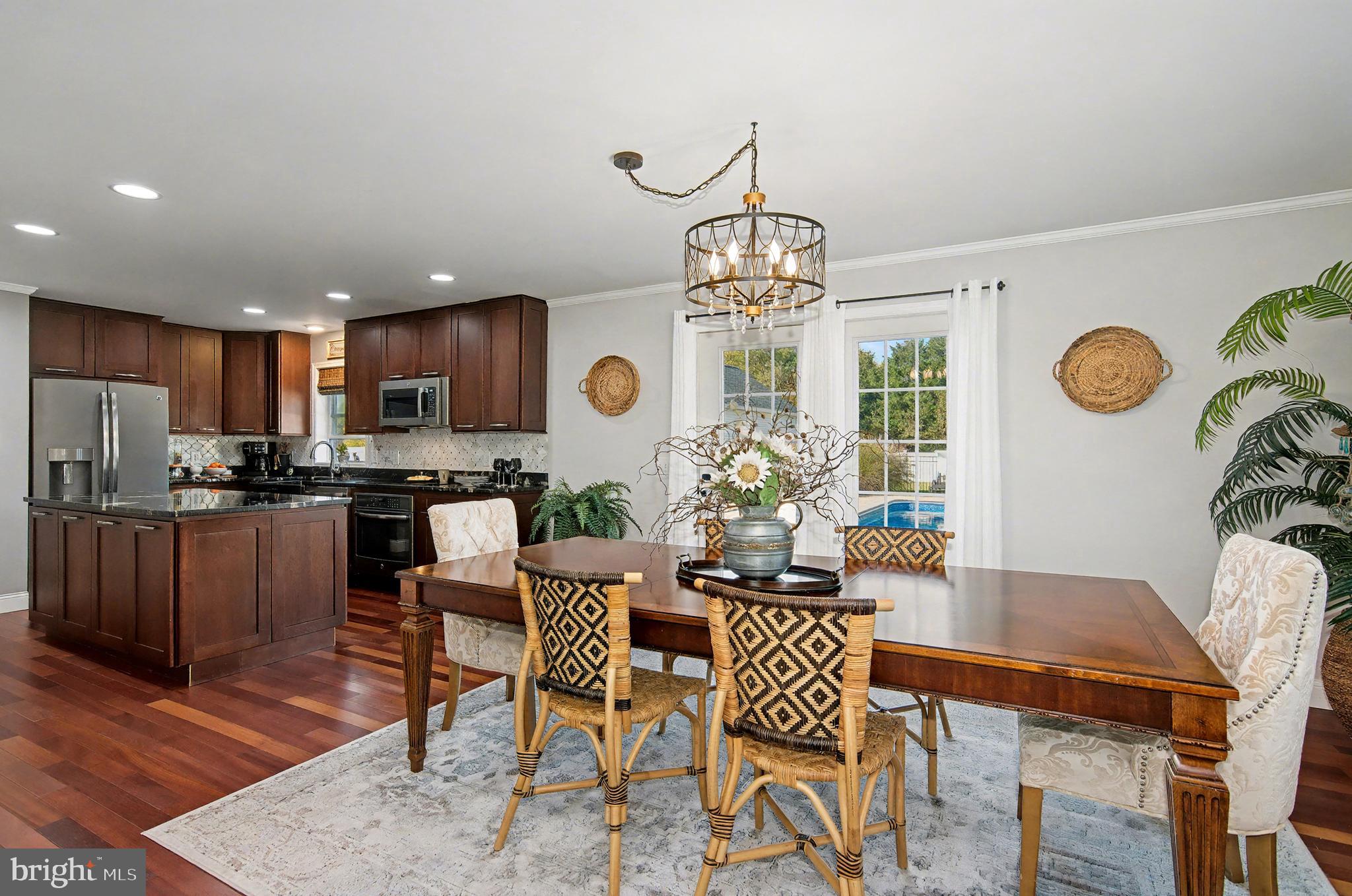 6660 Reeses Pride Road Sherwood, MD 21665 - Photo 36 of 72 a view of a dining room with furniture and chandelier