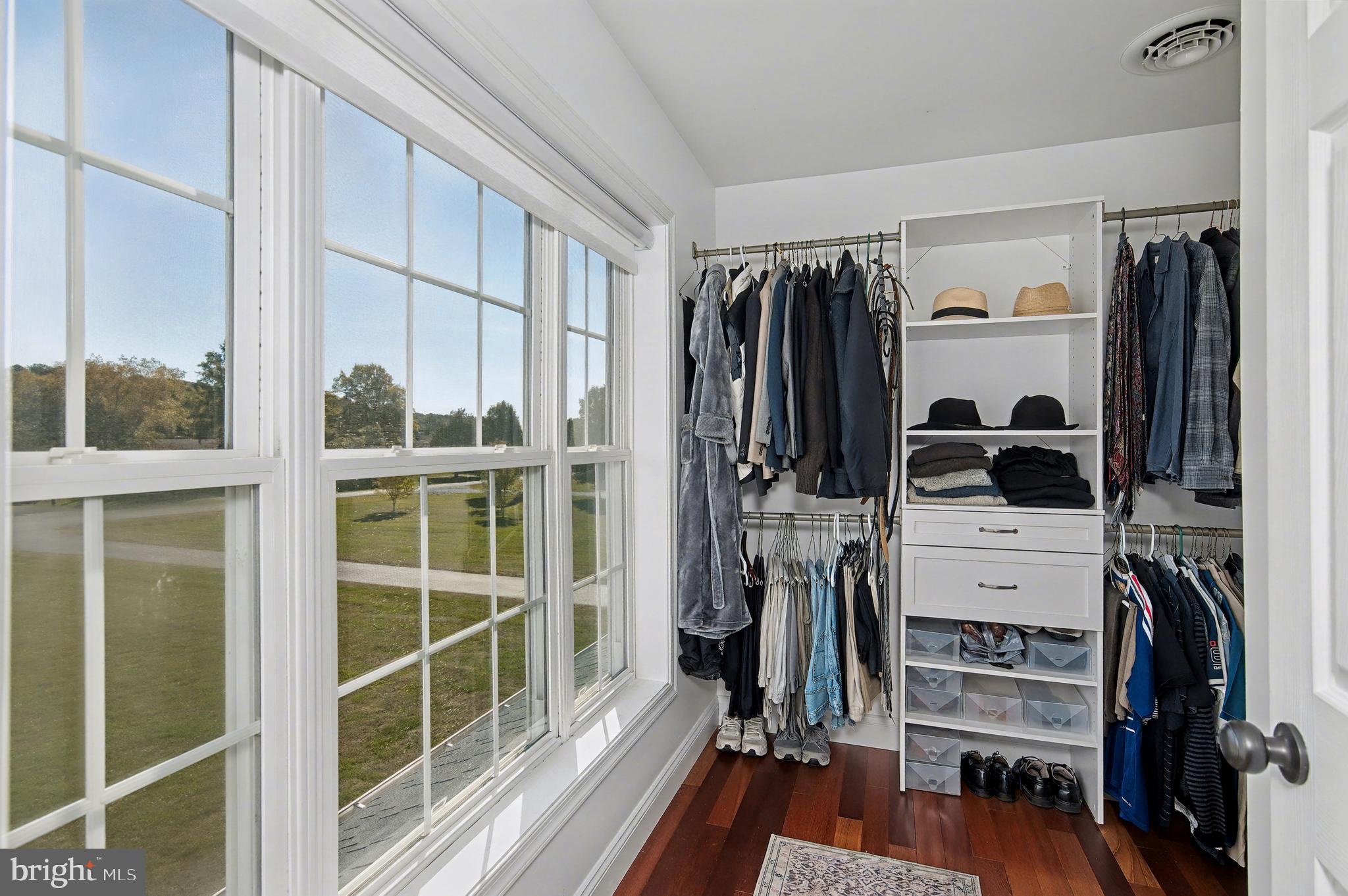 6660 Reeses Pride Road Sherwood, MD 21665 - Photo 45 of 72 a view of walk in closet with clothes and shoes