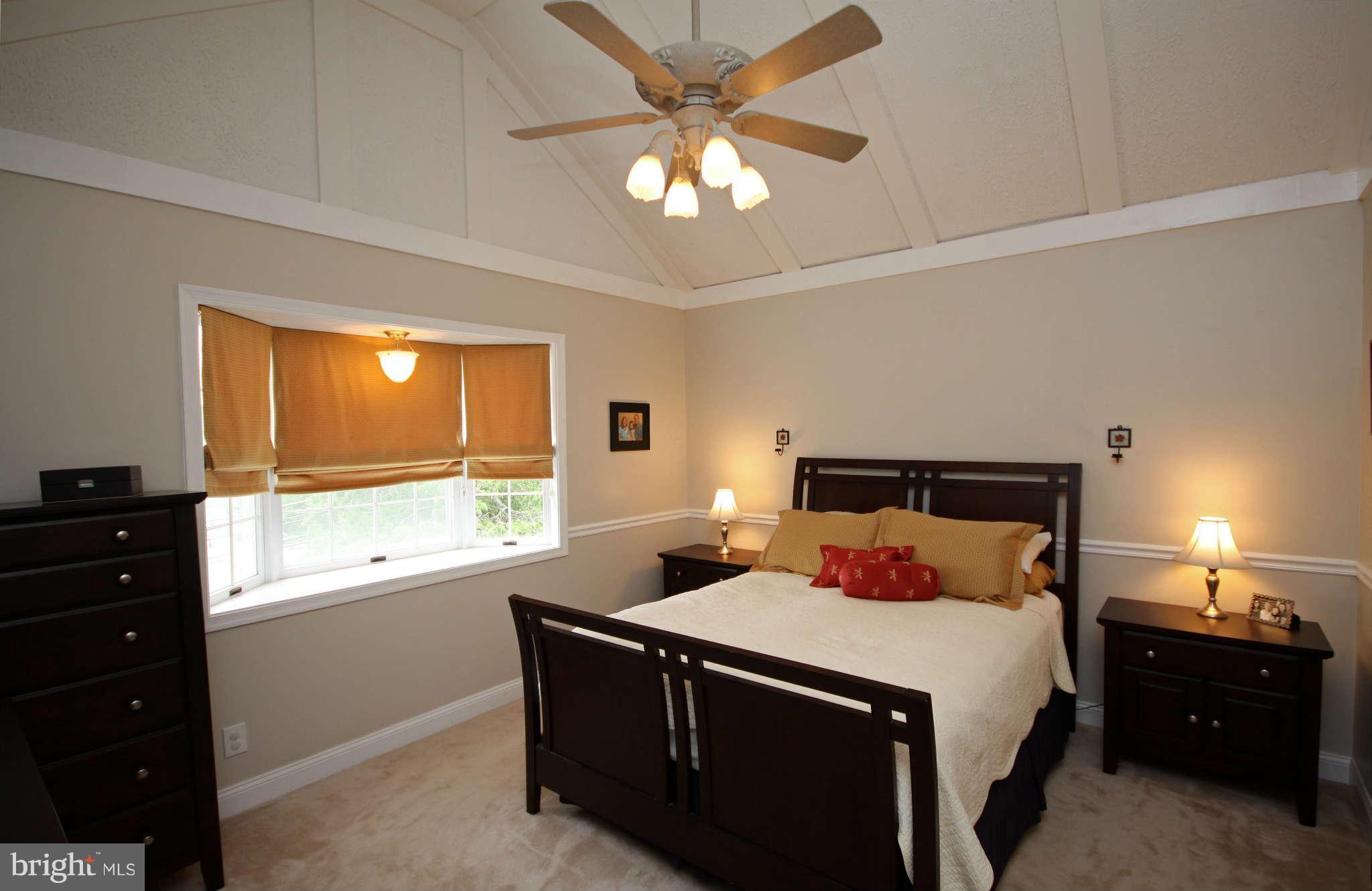 603 Academy Road Baltimore, MD 21228 - Photo 11 of 30 a bedroom with a bed and a window