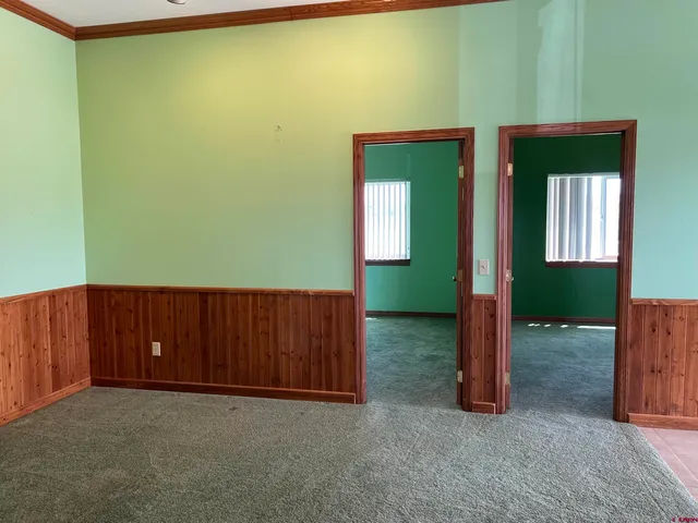 a view of a room with a fan and a window