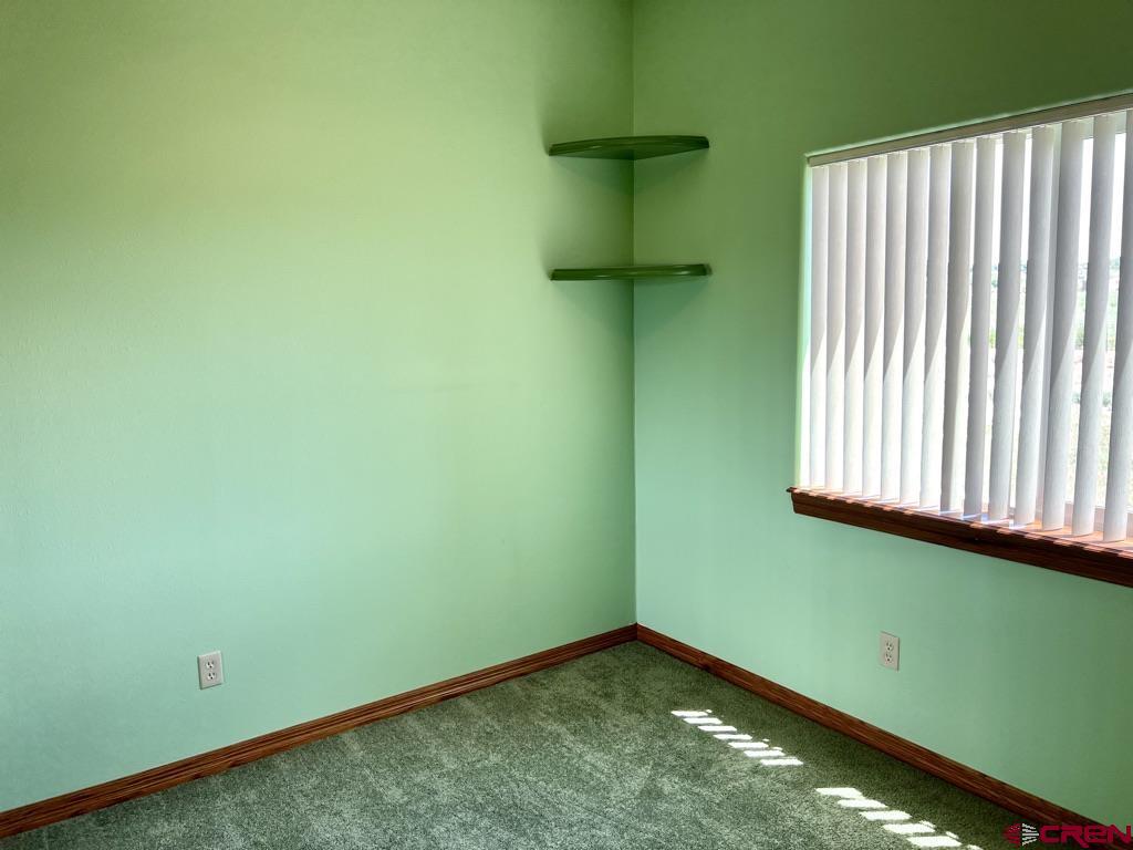 11604 5800th Road Montrose, CO 81403 - Photo 14 of 43 a view of a room with a fan and a window