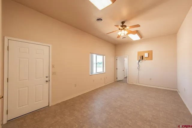 a bathroom with a granite countertop sink toilet and a mirror