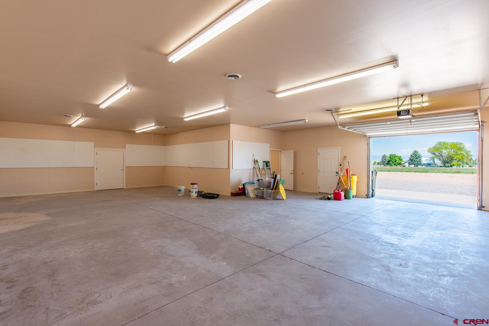 11604 5800th Road Montrose, CO 81403 - Photo 22 of 43 an empty room with garage and window