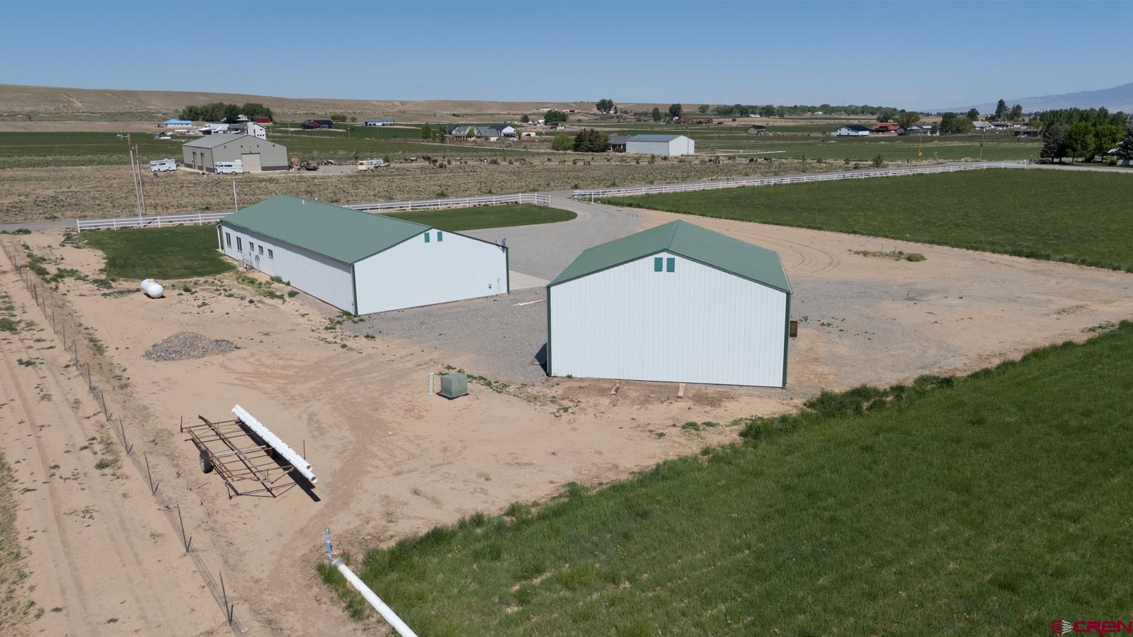 11604 5800th Road Montrose, CO 81403 - Photo 29 of 43 an aerial view of a house with a lake view