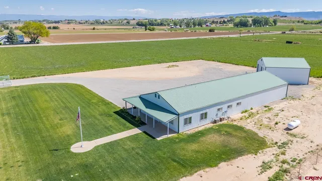a view of a field with sitting area
