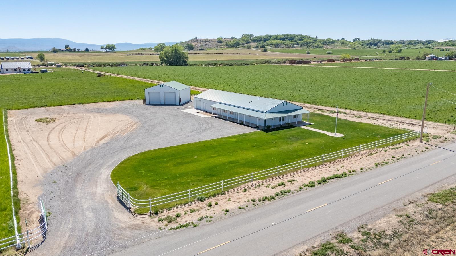 11604 5800th Road Montrose, CO 81403 - Photo 34 of 43 an aerial view of a golf course with a garden