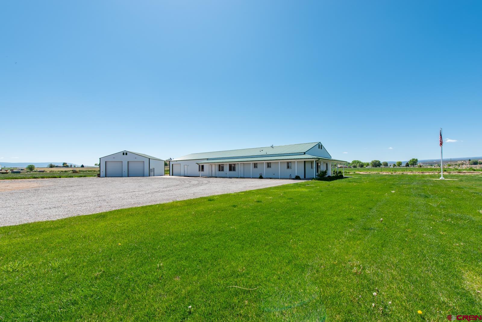 11604 5800th Road Montrose, CO 81403 - Photo 39 of 43 a view of a house with a yard and a large tree