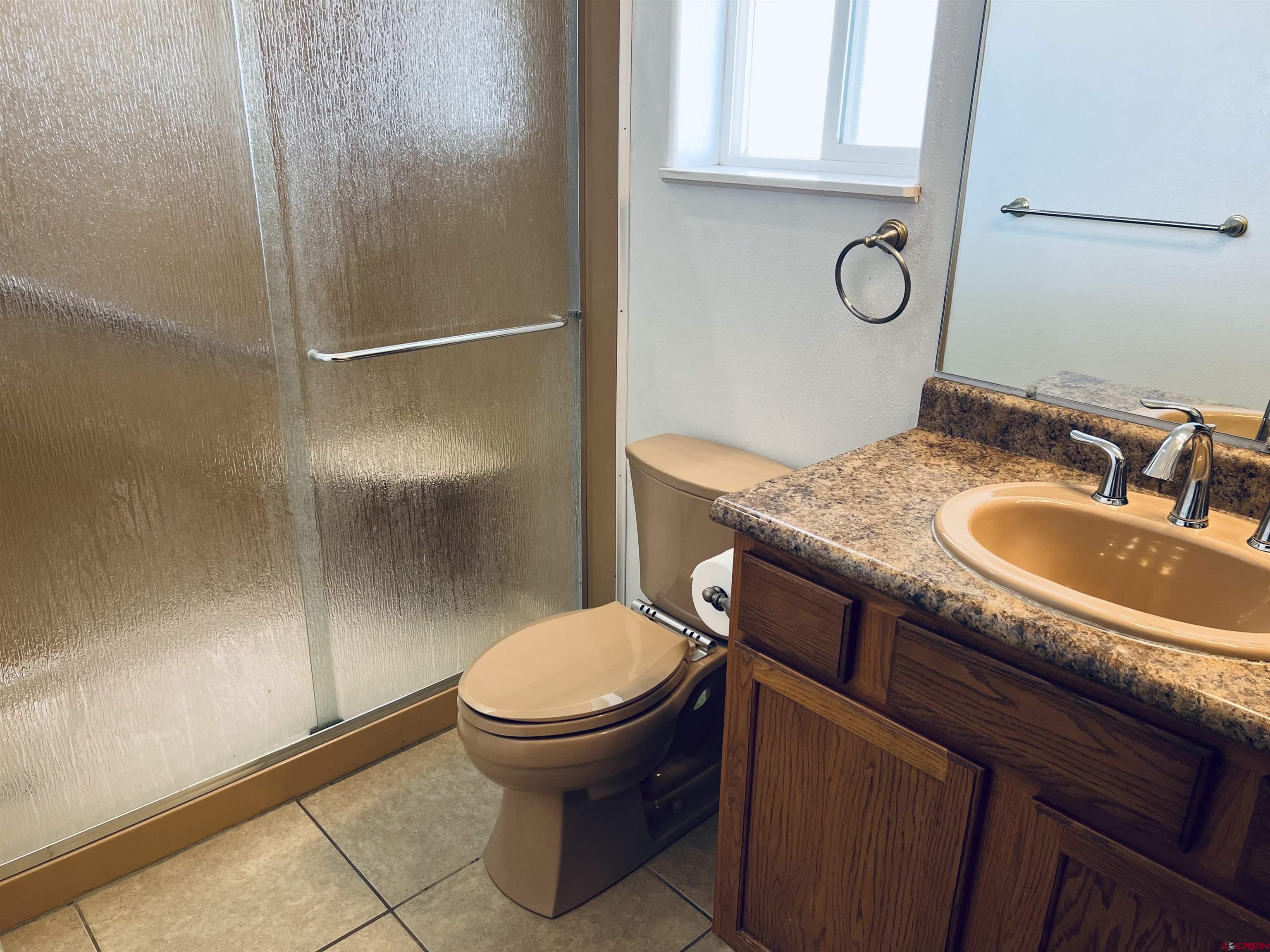 11604 5800th Road Montrose, CO 81403 - Photo 5 of 43 a bathroom with a sink toilet and shower