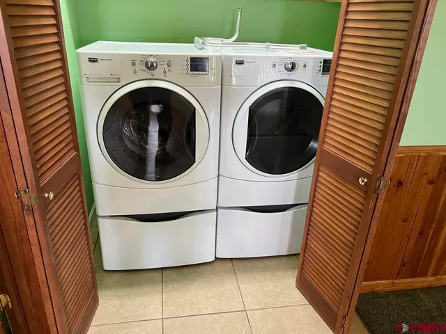 a utility room with dryer and washer