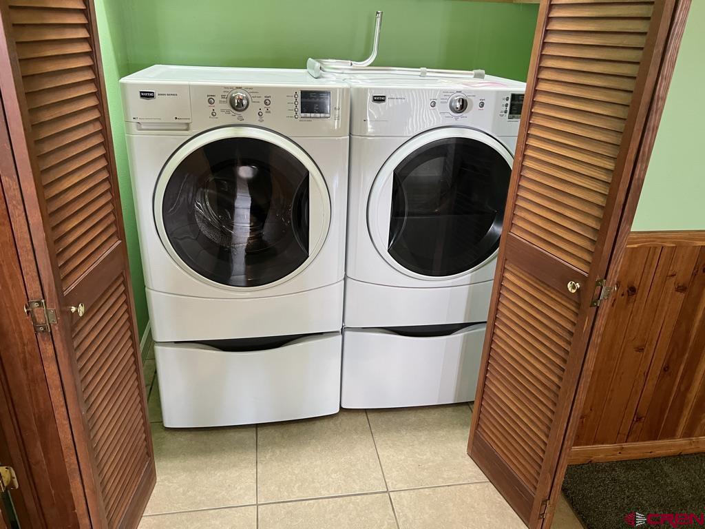 11604 5800th Road Montrose, CO 81403 - Photo 9 of 43 a utility room with dryer and washer