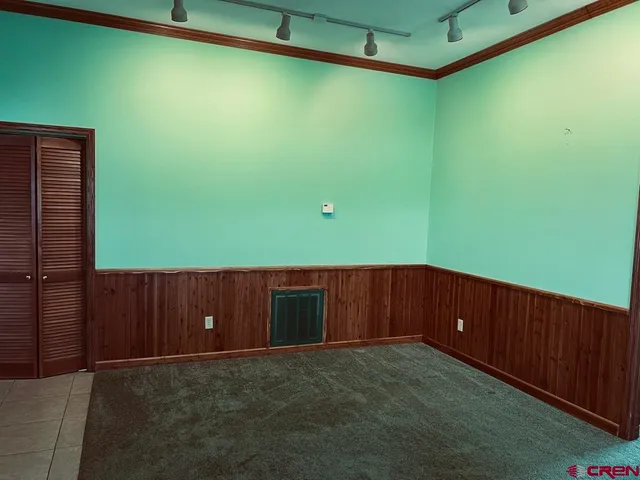 a room with a window and a ceiling fan