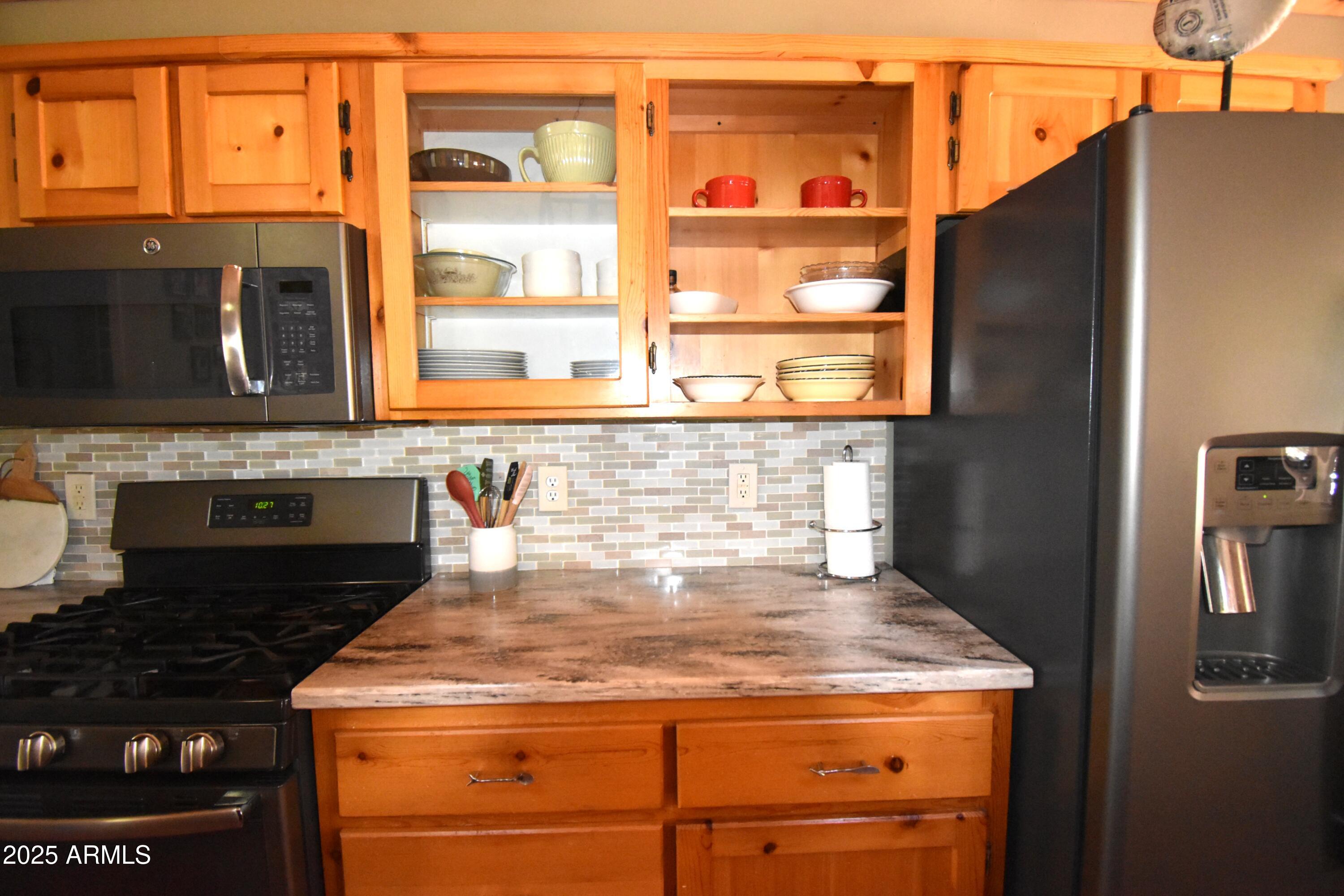 8742 Tonto Rim Drive Pine, AZ 85544 - Photo 14 of 41 a close view of a stove top oven a sink and dishwasher